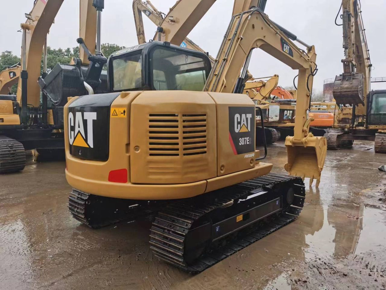 2018 Caterpillar 307E2 mini excavator, rear three-quarter view 2018 Caterpillar 307E2 mini excavator, rear three-quarter view
