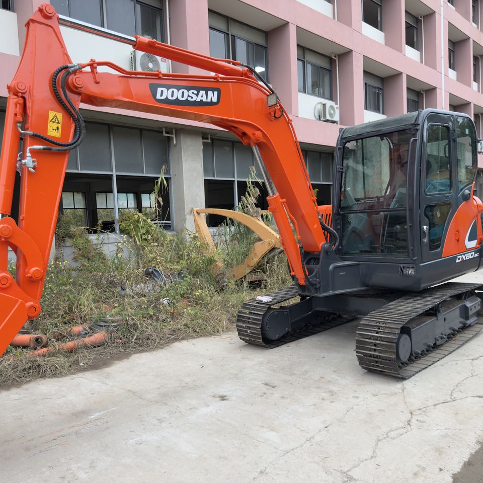 Doosan DX60-9C mini excavator, side view Doosan DX60-9C mini excavator, side view