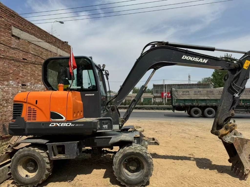2024 Doosan DX60W excavator, side profile view