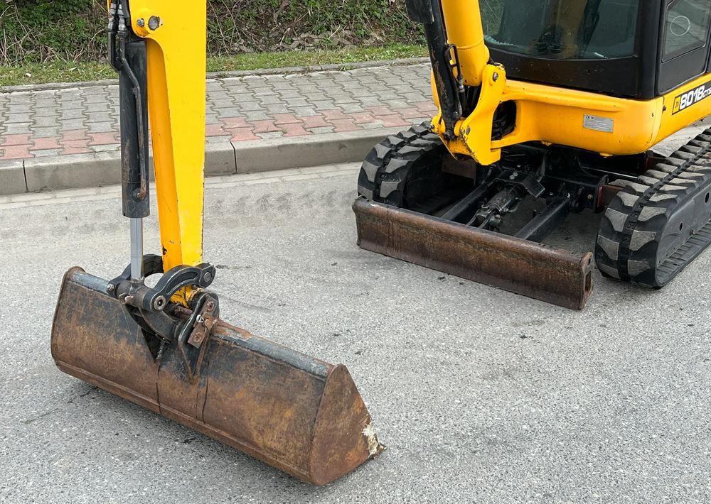 2012 JCB 8018 CTS mini excavator front view with bucket and blade