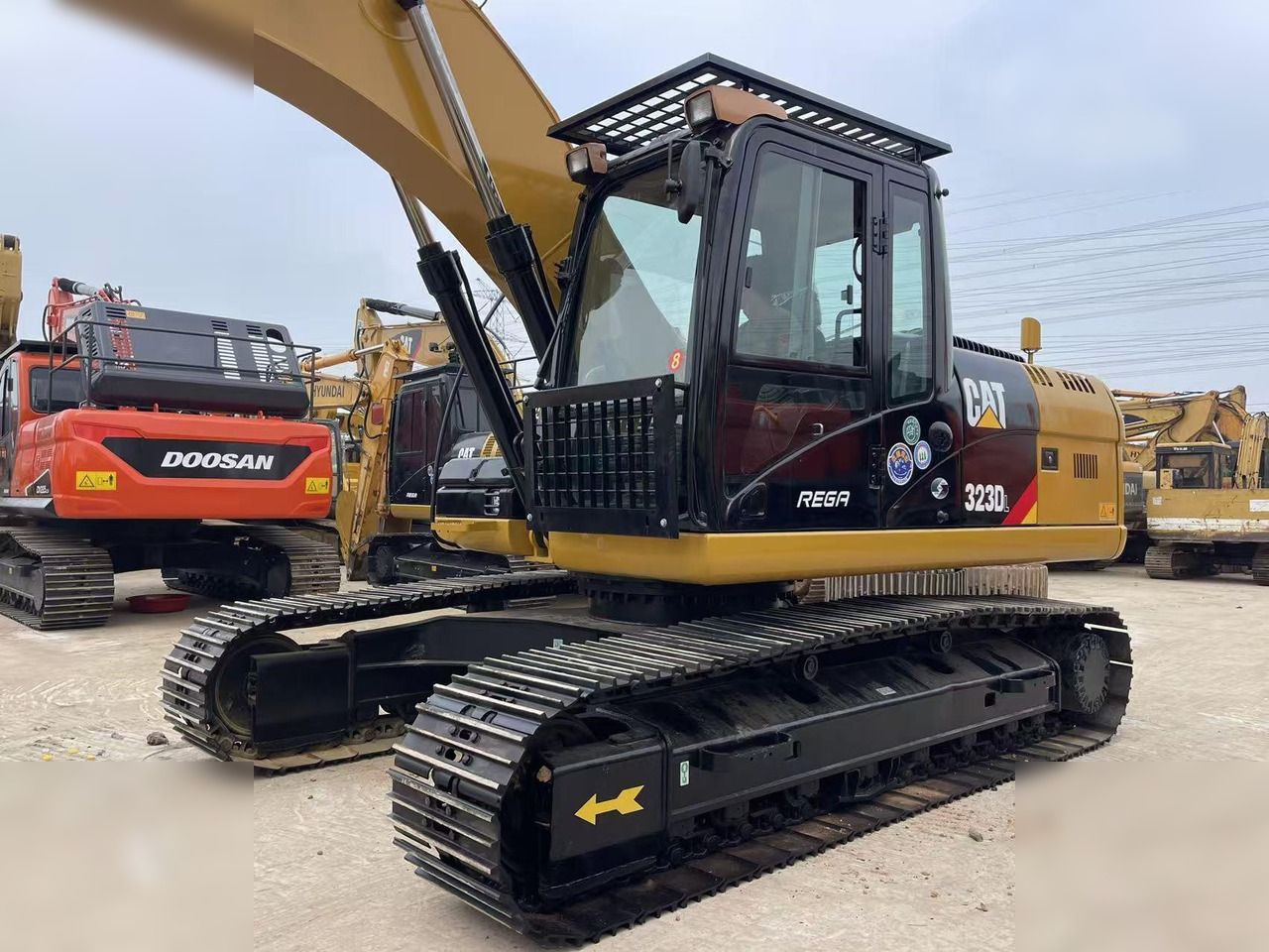 2023 Caterpillar 323DL crawler excavator, side view