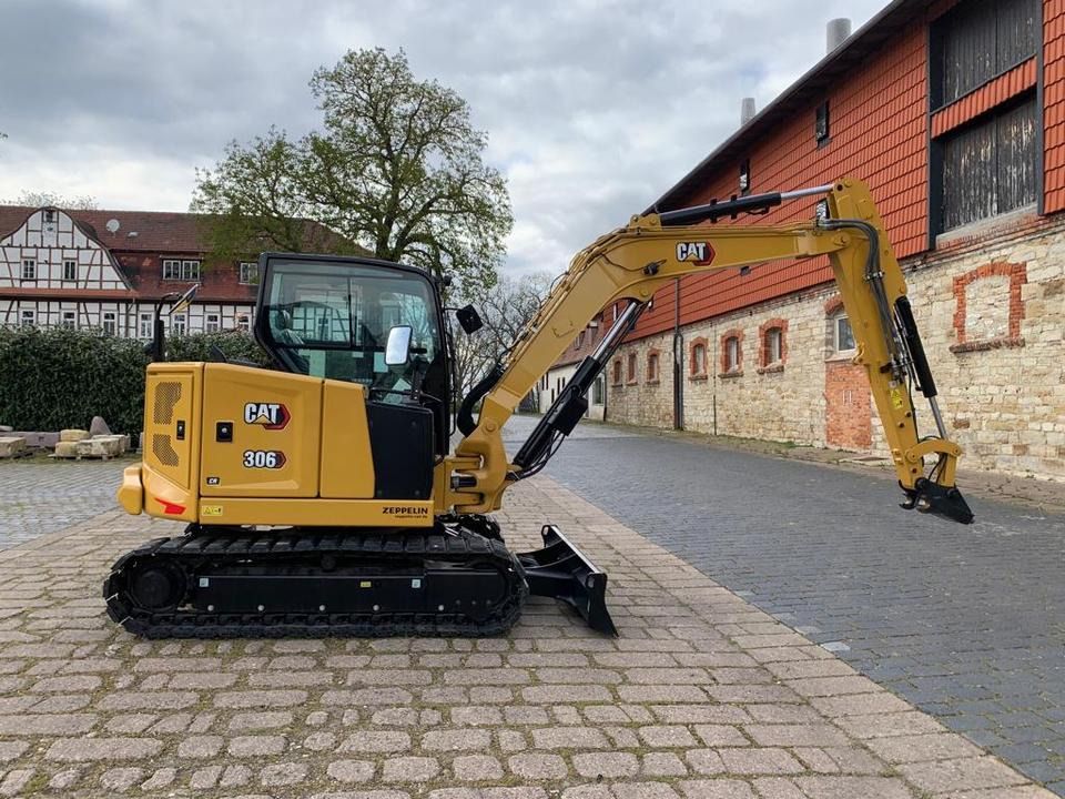 Caterpillar 306CR-07A mini excavator, side view Caterpillar 306CR-07A mini excavator, side view