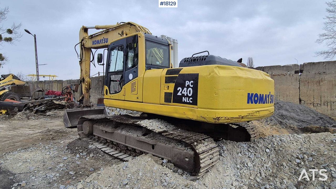 2006 Komatsu PC240NLC excavator, rear three-quarter view 2006 Komatsu PC240NLC excavator, rear three-quarter view