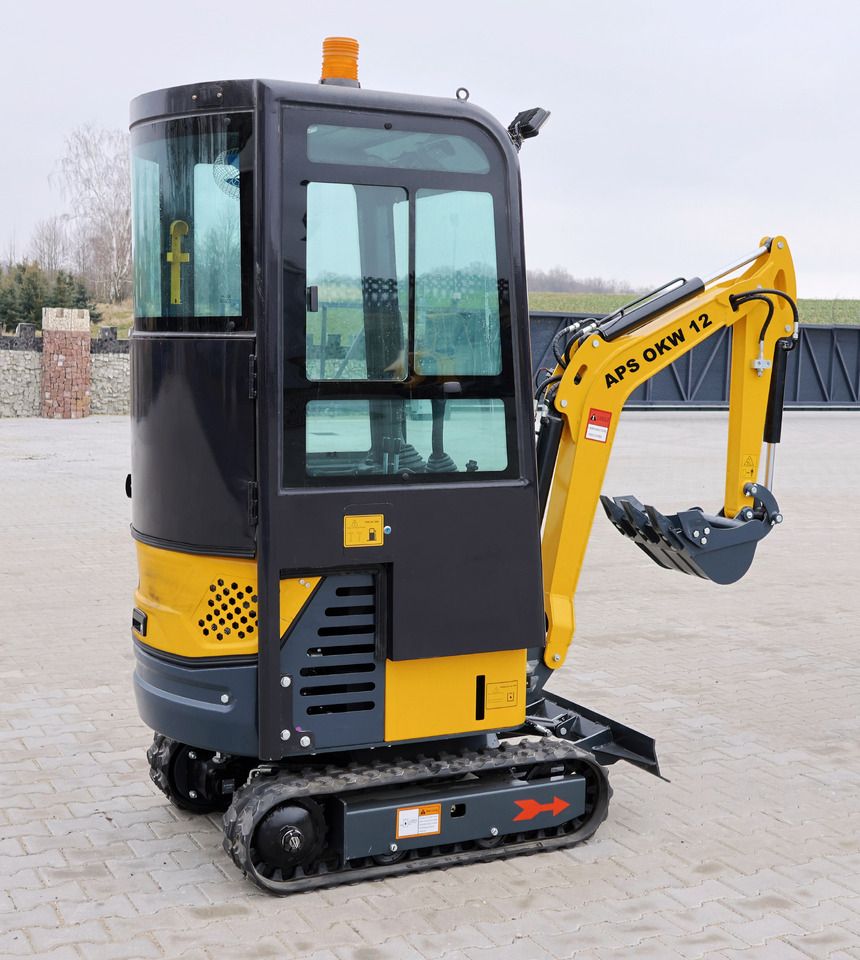 APS OKW12 mini excavator, rear three-quarter view APS OKW12 mini excavator, rear three-quarter view