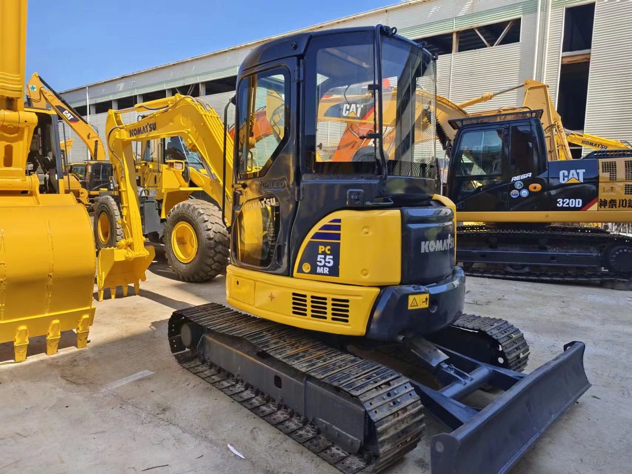 2018 Komatsu PC-55MR mini excavator, front three-quarter view