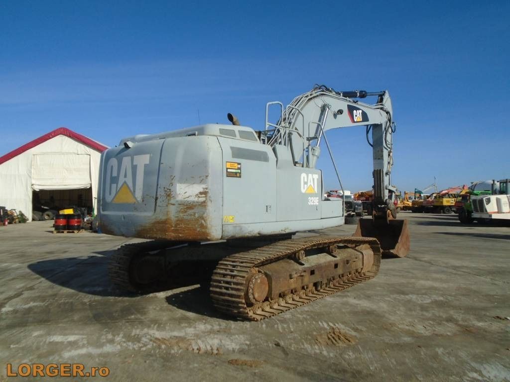 2014 Caterpillar 329EL crawler excavator, rear three-quarter view