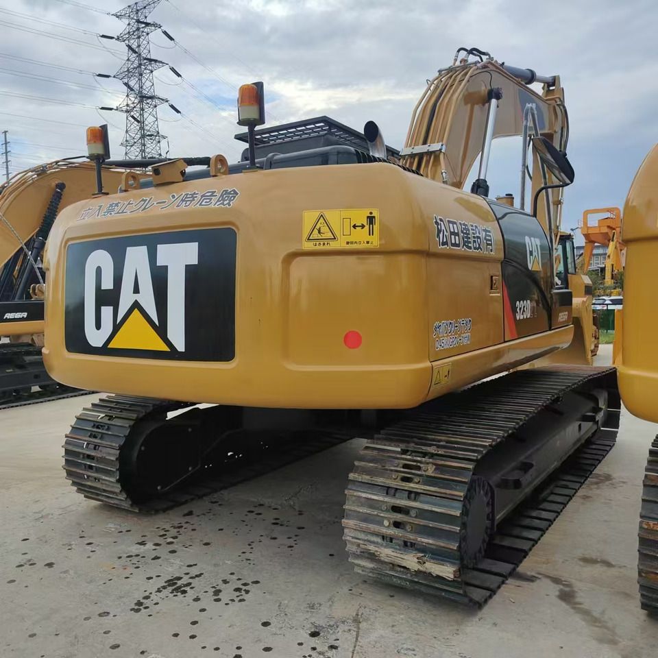 2022 Caterpillar 323D2L crawler excavator, rear three-quarter view 2022 Caterpillar 323D2L crawler excavator, rear three-quarter view