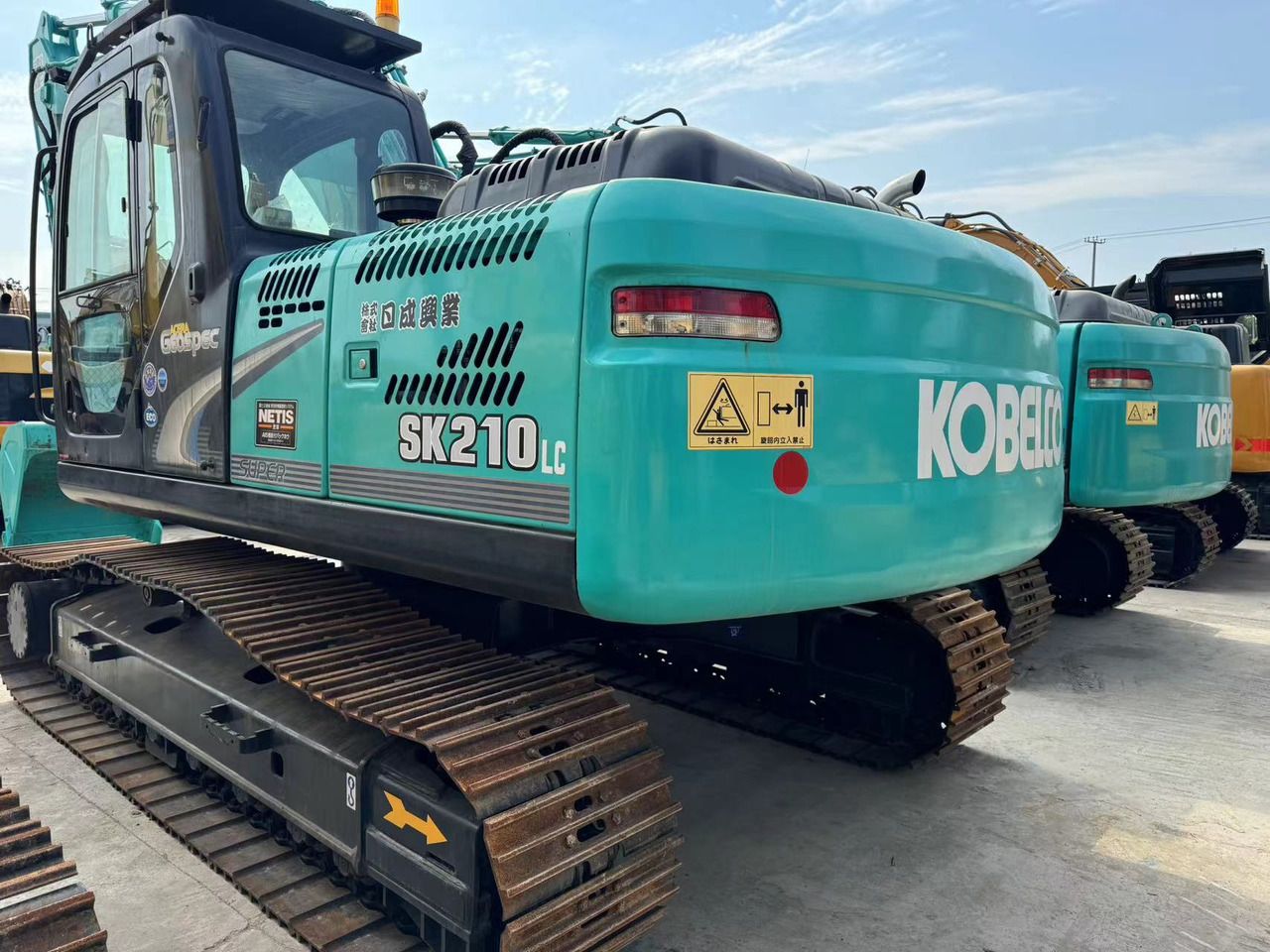 Kobelco SK210LC crawler excavator, rear three-quarter view Kobelco SK210LC crawler excavator, rear three-quarter view
