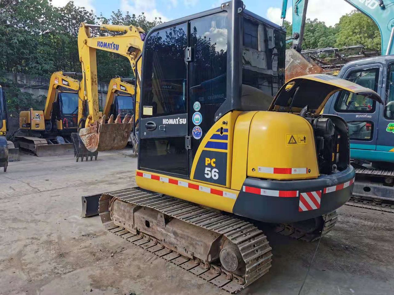 2016 Komatsu PC56-7 mini excavator, rear three-quarter view 2016 Komatsu PC56-7 mini excavator, rear three-quarter view