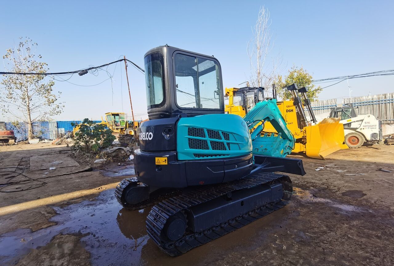 2019 Kobelco SK55 mini excavator, rear three-quarter view 2019 Kobelco SK55 mini excavator, rear three-quarter view