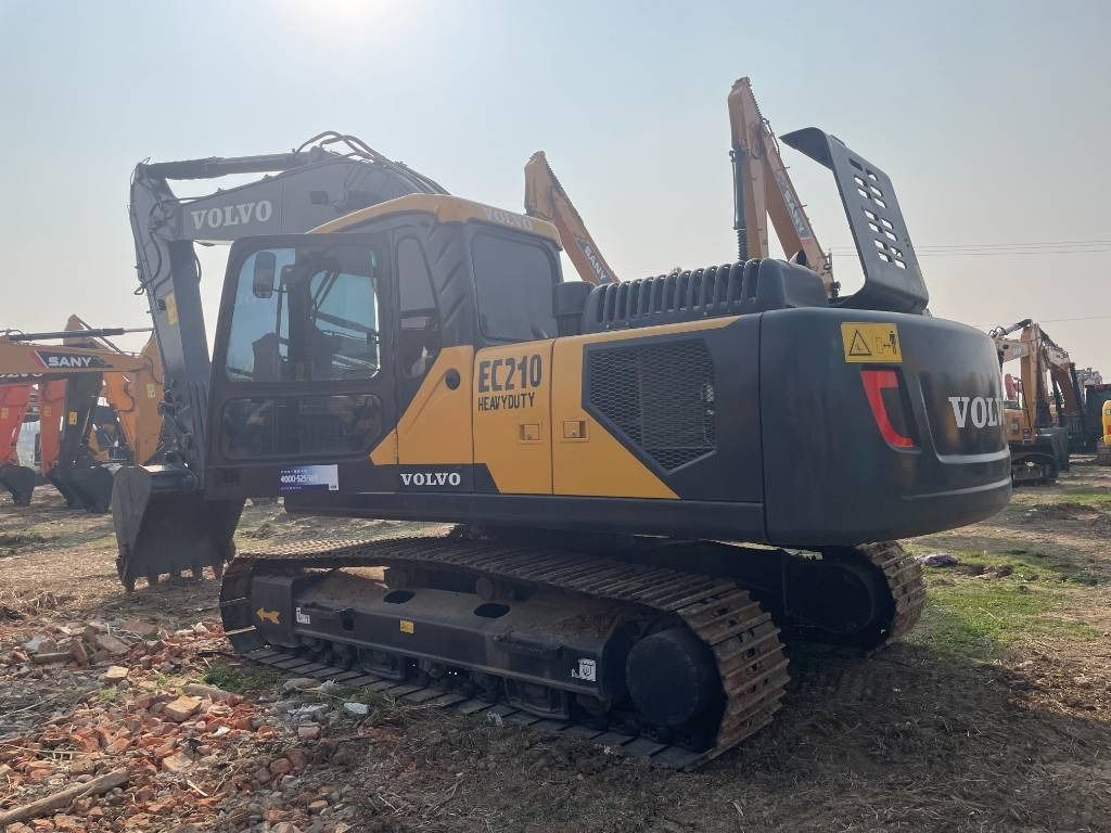 2025 Volvo EC210 crawler excavator, rear three-quarter view