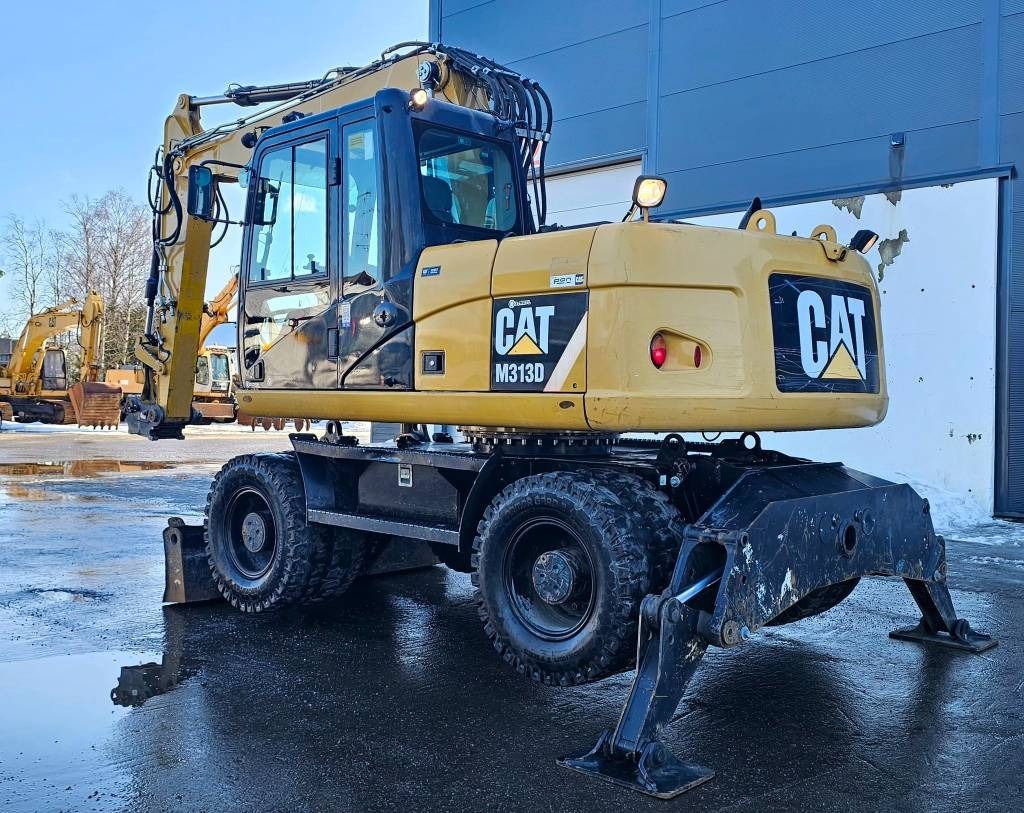 2012 Caterpillar M313D wheel excavator, rear three-quarter view