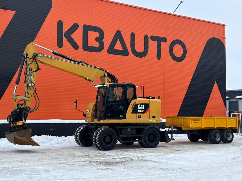 2017 Caterpillar M314F wheel excavator with trailer, side view 2017 Caterpillar M314F wheel excavator with trailer, side view