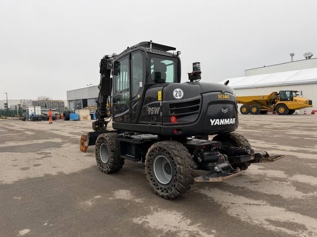2023 Yanmar B95W wheeled excavator, rear three-quarter view