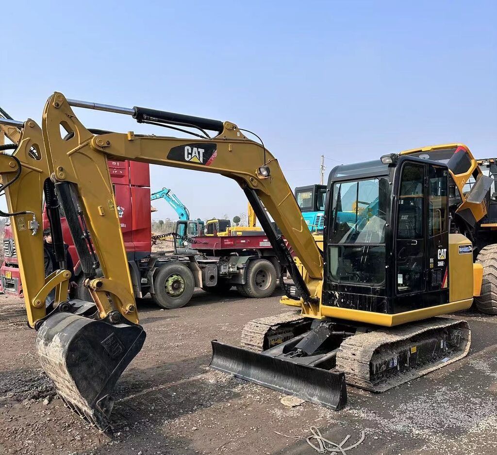 Caterpillar 306E mini excavator, side view Caterpillar 306E mini excavator, side view