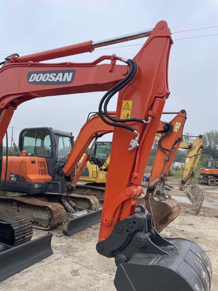 2023 Doosan DX60-9C mini excavator, front three-quarter view