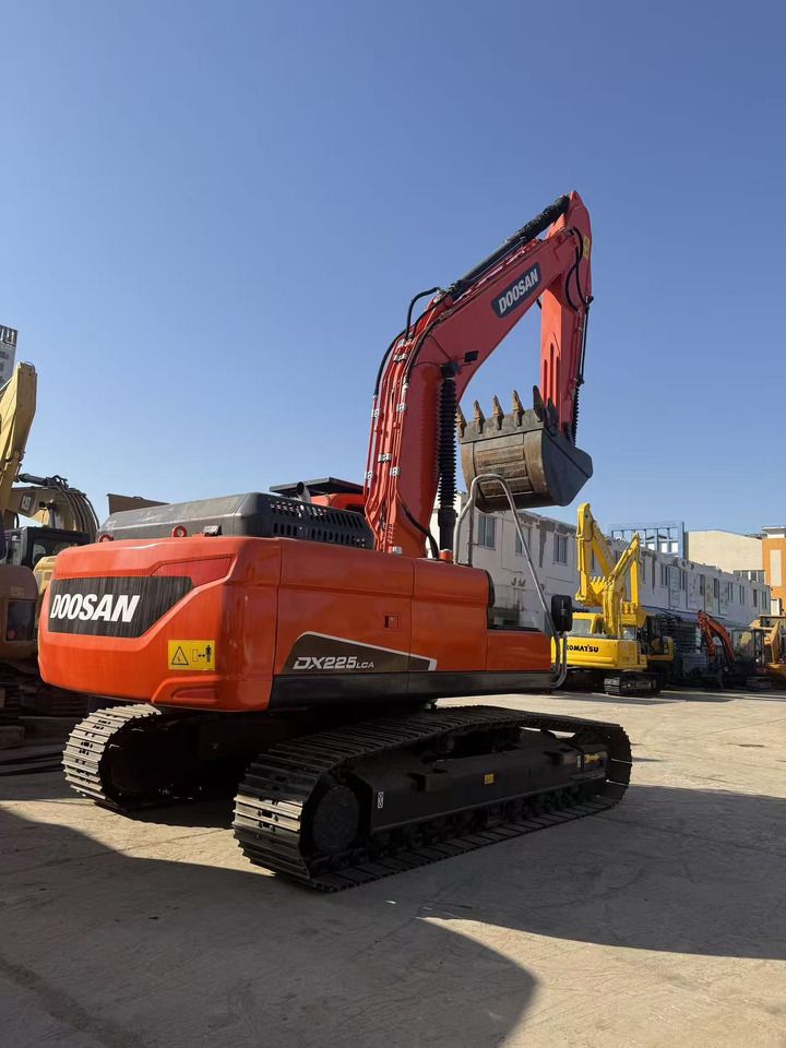 2024 Doosan DX225LCA crawler excavator, rear three-quarter view 2024 Doosan DX225LCA crawler excavator, rear three-quarter view