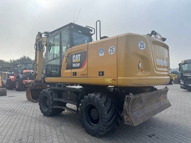 2020 Caterpillar M320F wheel excavator, rear three-quarter view