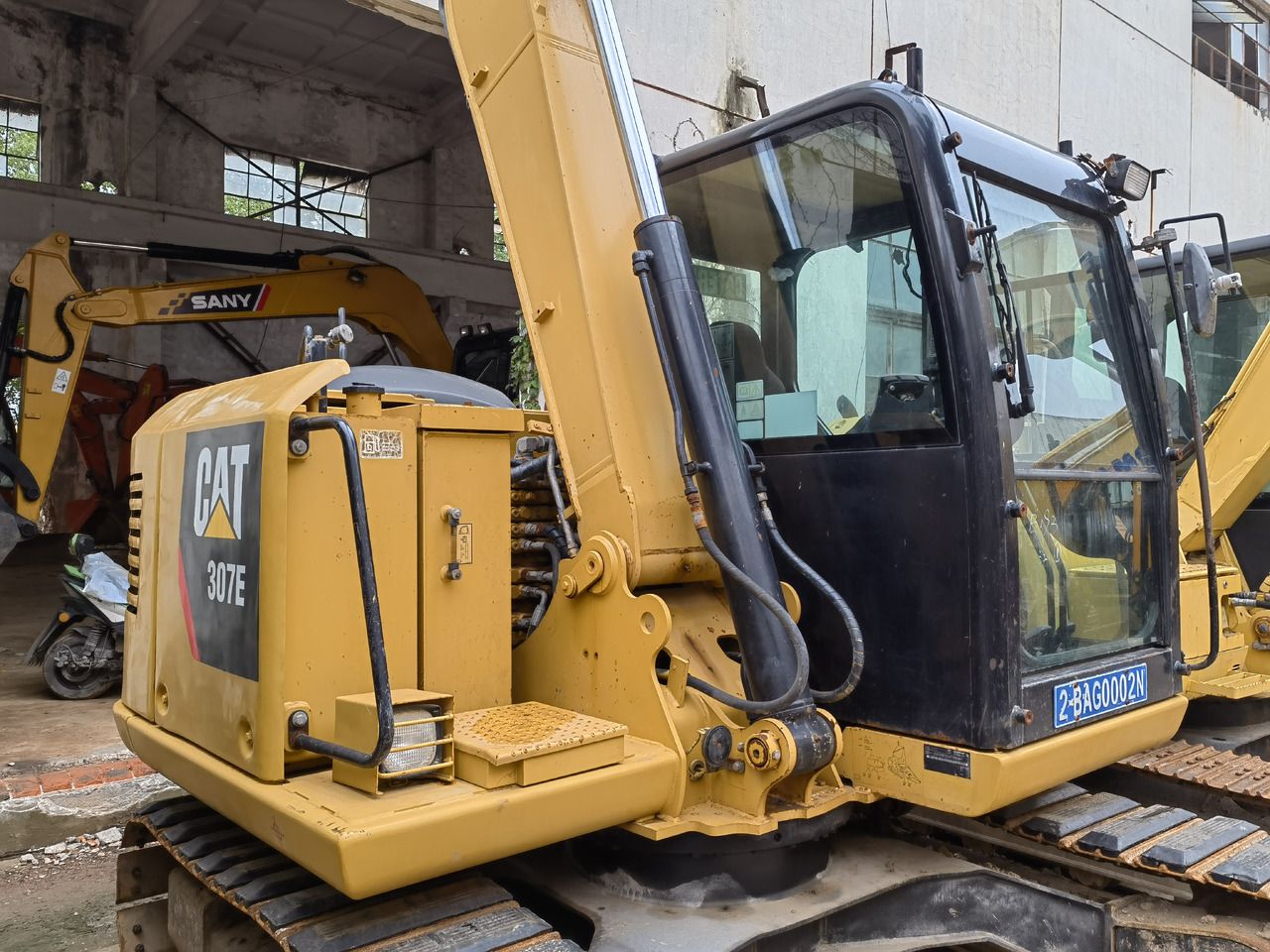 2024 Caterpillar 307E excavator, rear three-quarter view