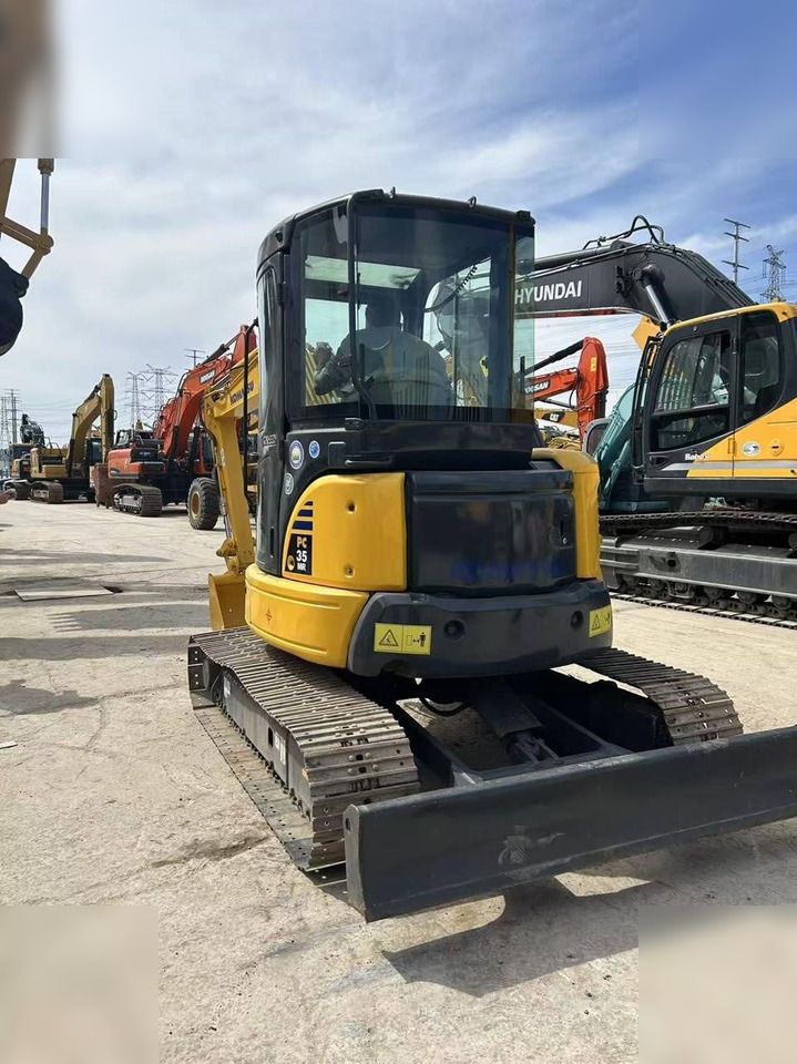 2024 Komatsu PC35MR-2 mini excavator, rear three-quarter view 2024 Komatsu PC35MR-2 mini excavator, rear three-quarter view