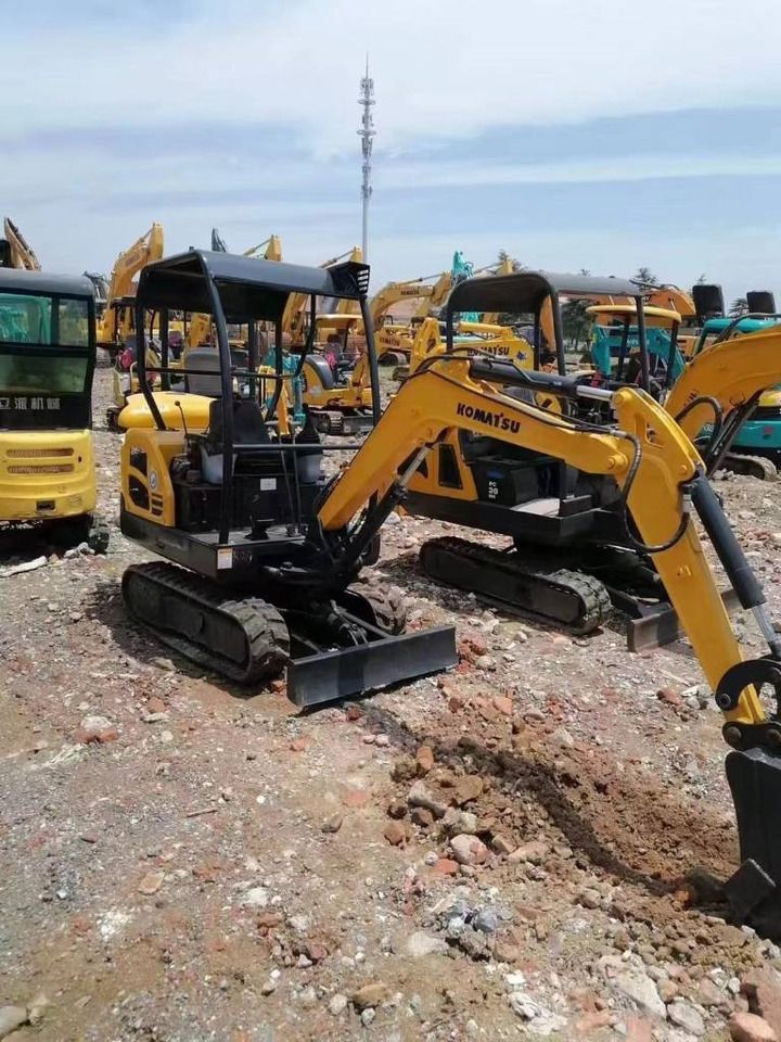 2024 Komatsu PC18 mini excavator, rear three-quarter view
