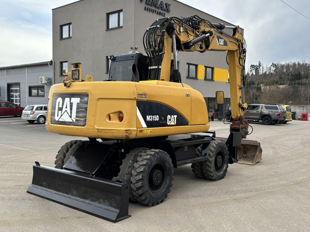 2012 Caterpillar M315D wheel excavator, rear three-quarter view 2012 Caterpillar M315D wheel excavator, rear three-quarter view