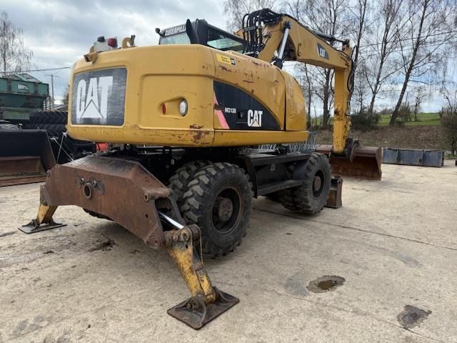 2010 Caterpillar M313D wheel excavator rear view 2010 Caterpillar M313D wheel excavator rear view
