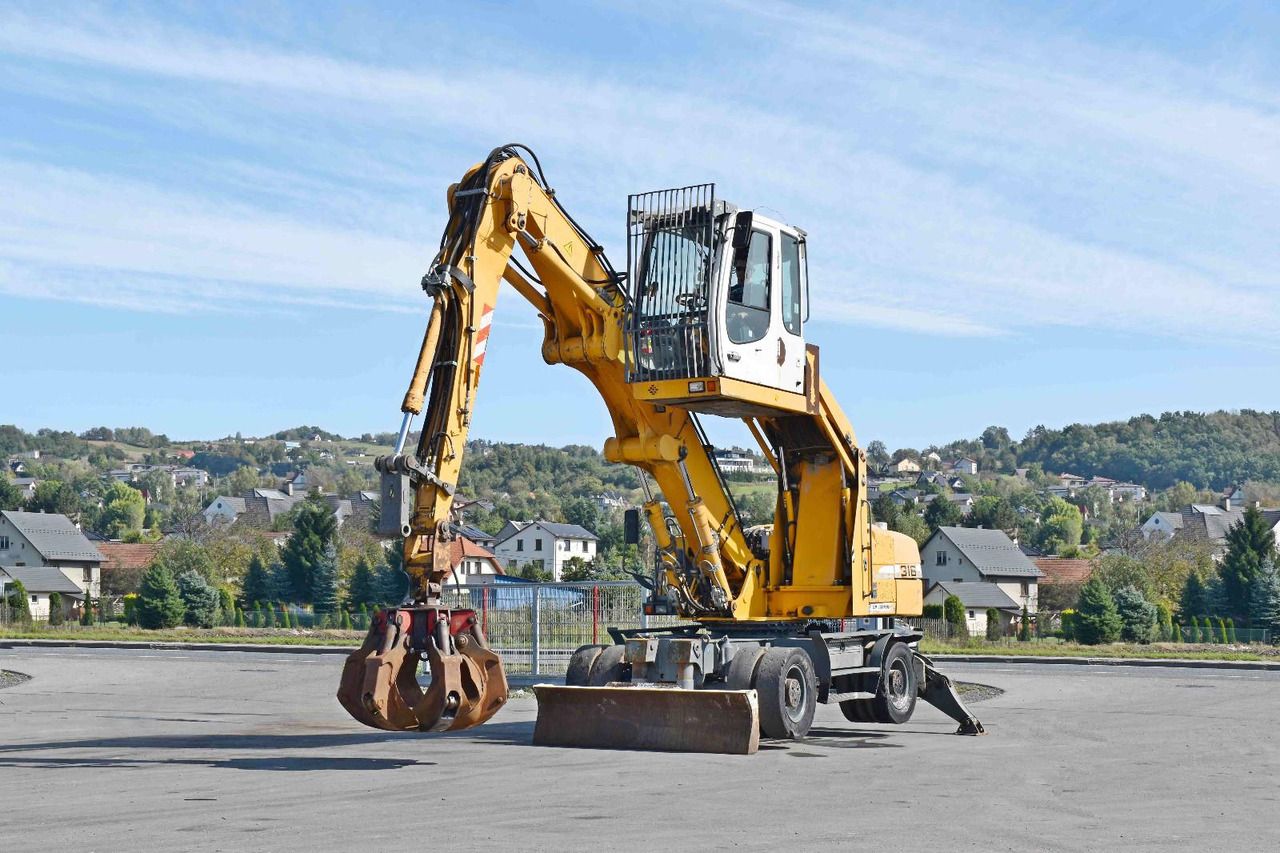 2008 Liebherr A316 wheel excavator, side view 2008 Liebherr A316 wheel excavator, side view