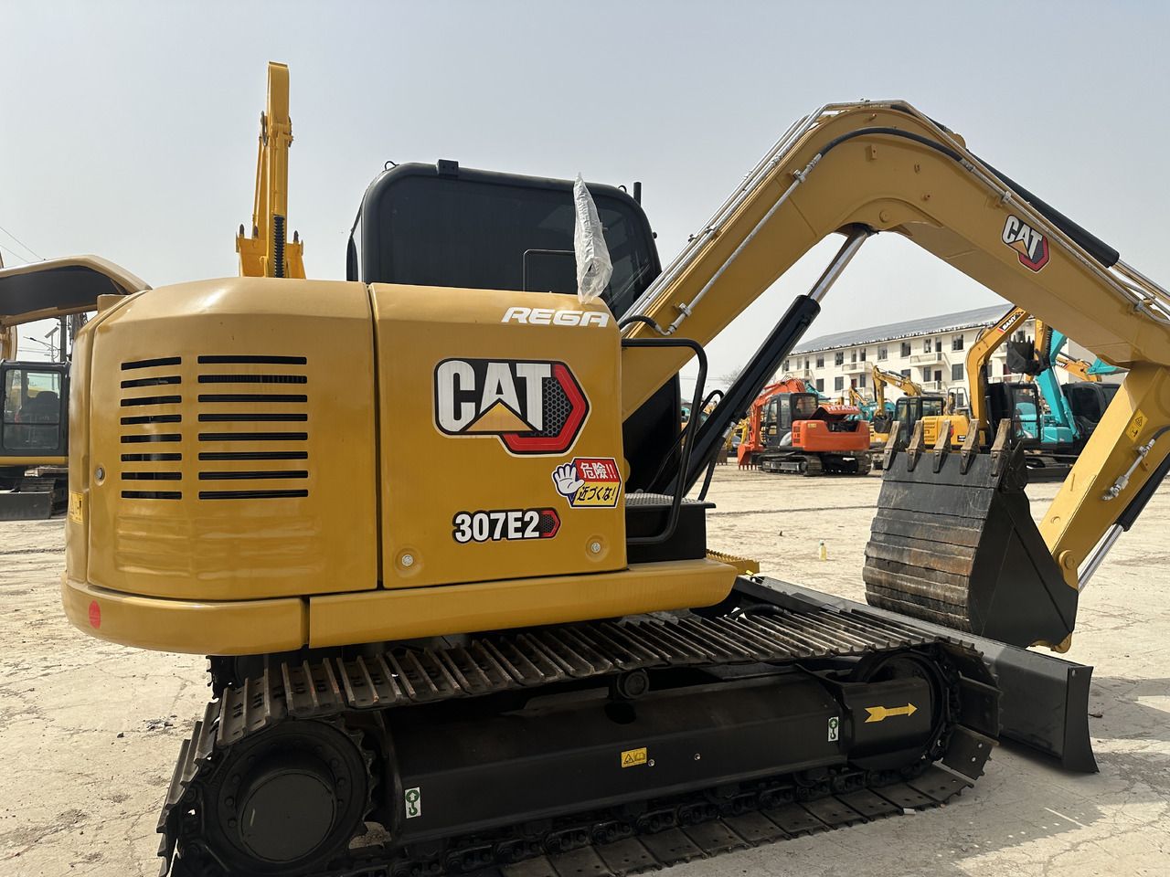 2023 Caterpillar 307E2 mini excavator rear three-quarter view 2023 Caterpillar 307E2 mini excavator rear three-quarter view