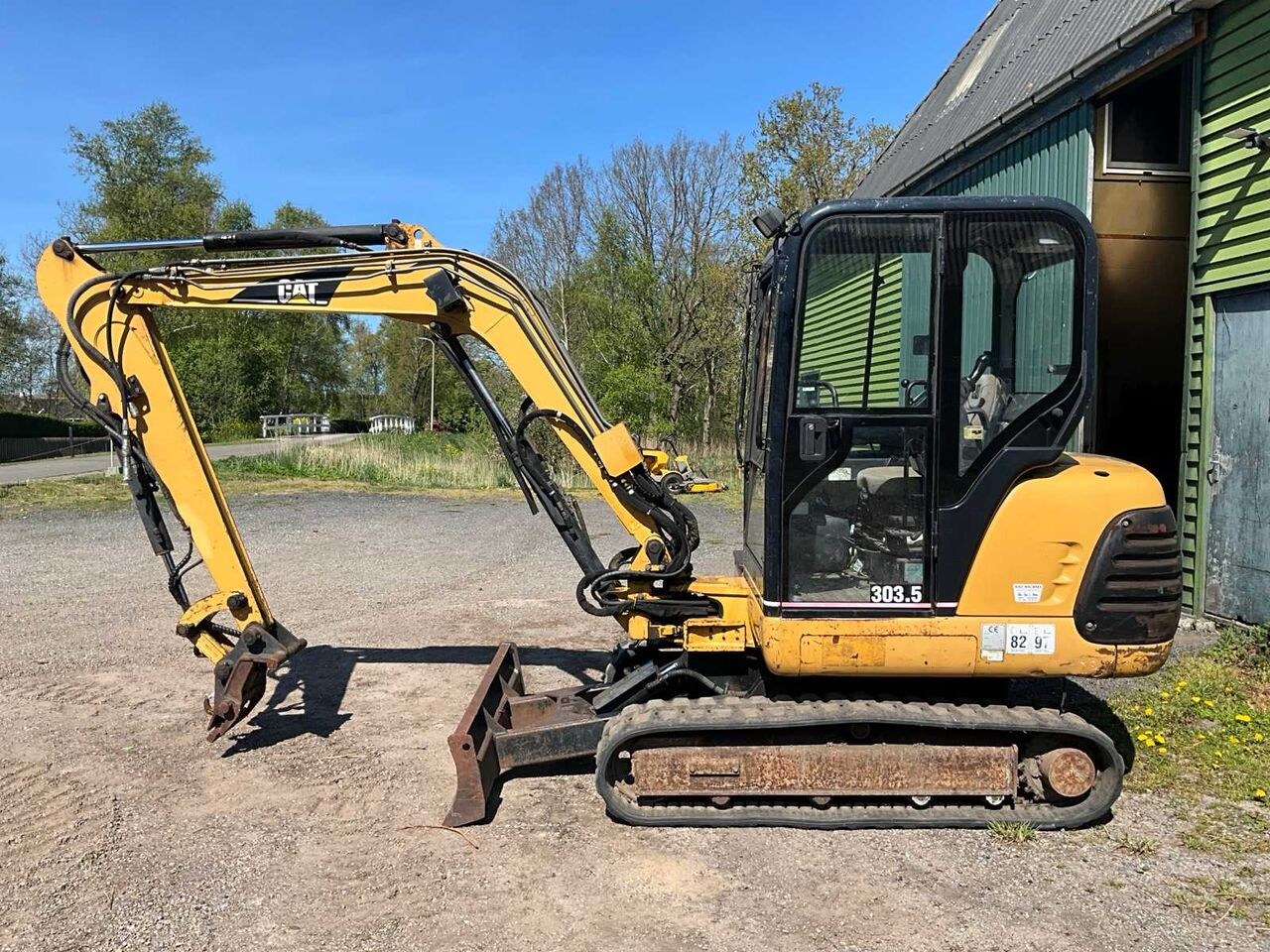 Caterpillar 303.5 mini excavator, side view Caterpillar 303.5 mini excavator, side view