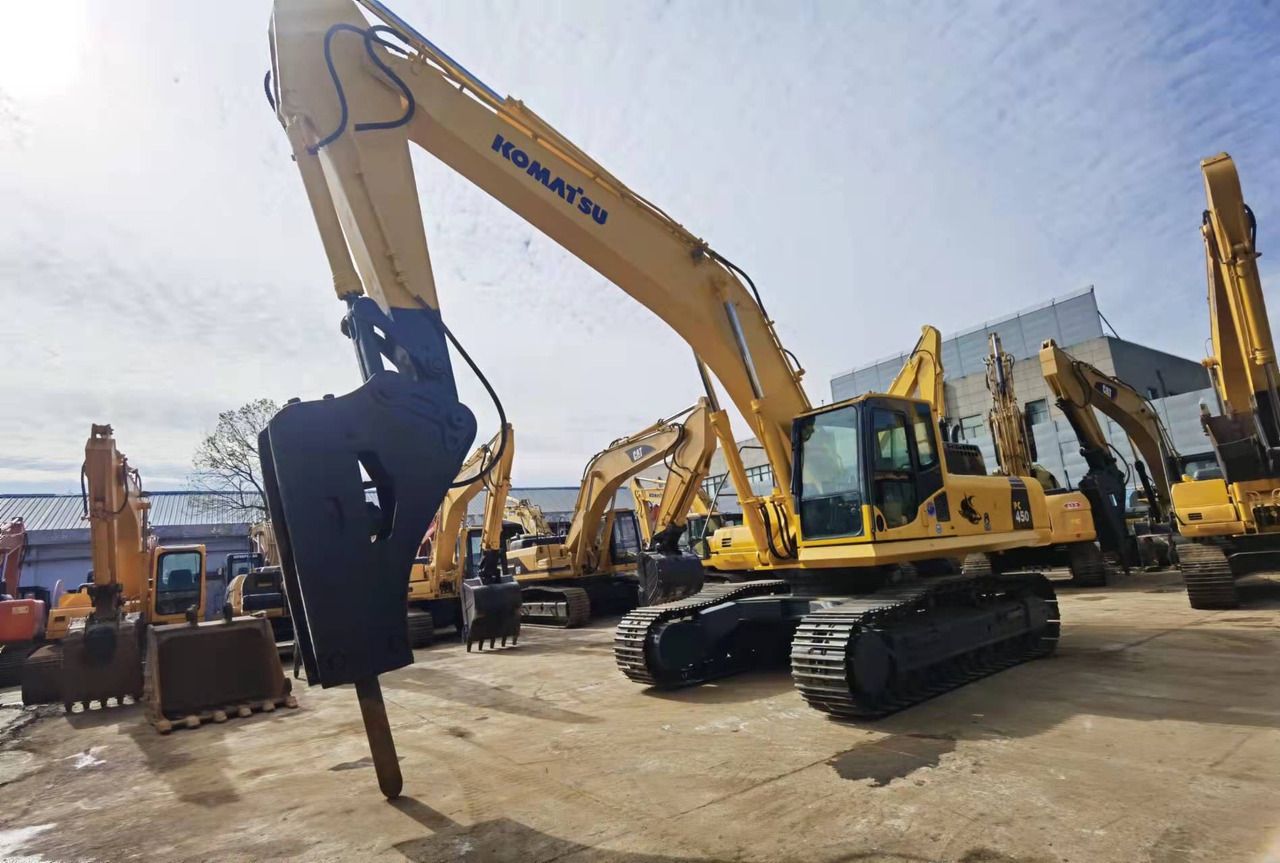 2019 Komatsu PC450-8 crawler excavator with hydraulic breaker attachment, front three-quarter view