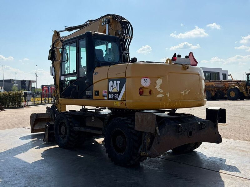 2012 Caterpillar M313D wheel excavator rear three-quarter view 2012 Caterpillar M313D wheel excavator rear three-quarter view