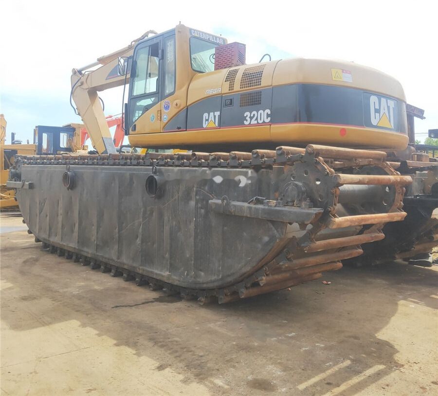 2010 Caterpillar 320C amphibious excavator, rear three-quarter view