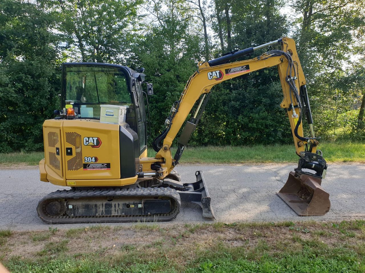 2022 Caterpillar 304 mini excavator, side view