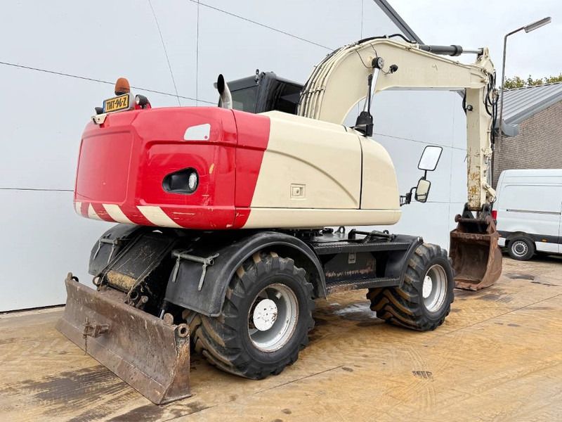 2011 Caterpillar M316D wheel excavator, rear three-quarter view 2011 Caterpillar M316D wheel excavator, rear three-quarter view