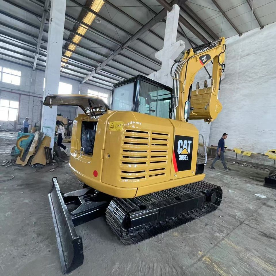 2023 Caterpillar 306E2 mini excavator rear three-quarter view 2023 Caterpillar 306E2 mini excavator rear three-quarter view