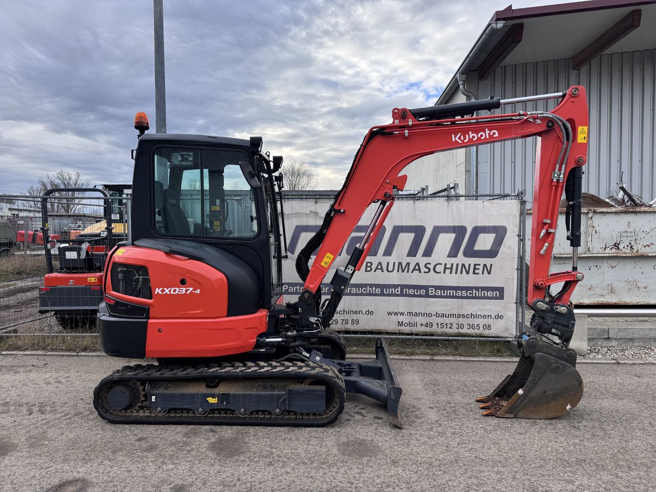2023 Kubota KX037-4 mini excavator, side view