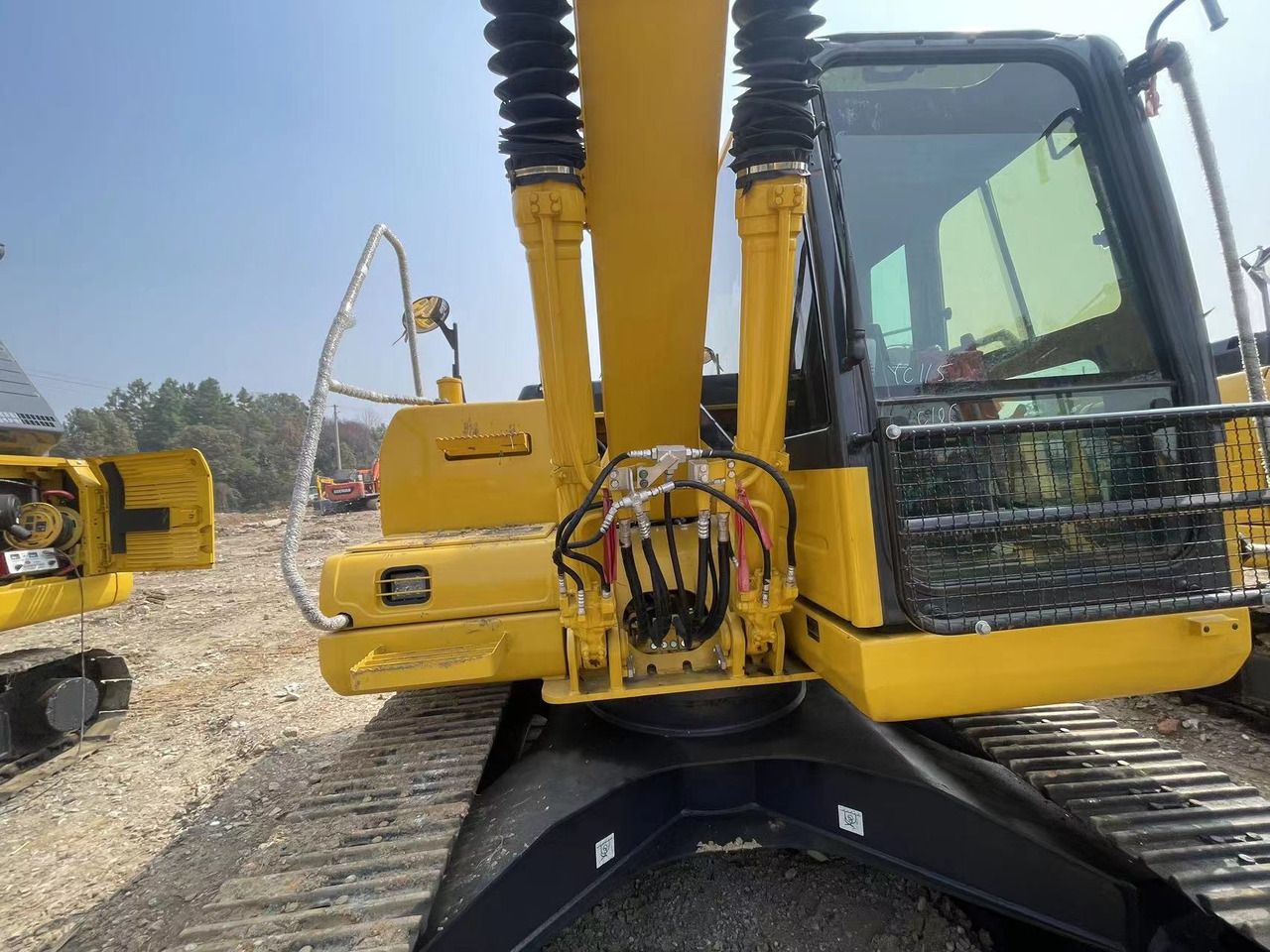 2022 Komatsu PC120-8 crawler excavator, rear view of boom and cab 2022 Komatsu PC120-8 crawler excavator, rear view of boom and cab