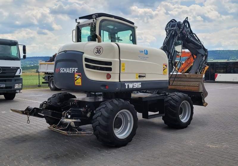 2017 Schaeff TW95 wheel excavator, rear three-quarter view 2017 Schaeff TW95 wheel excavator, rear three-quarter view