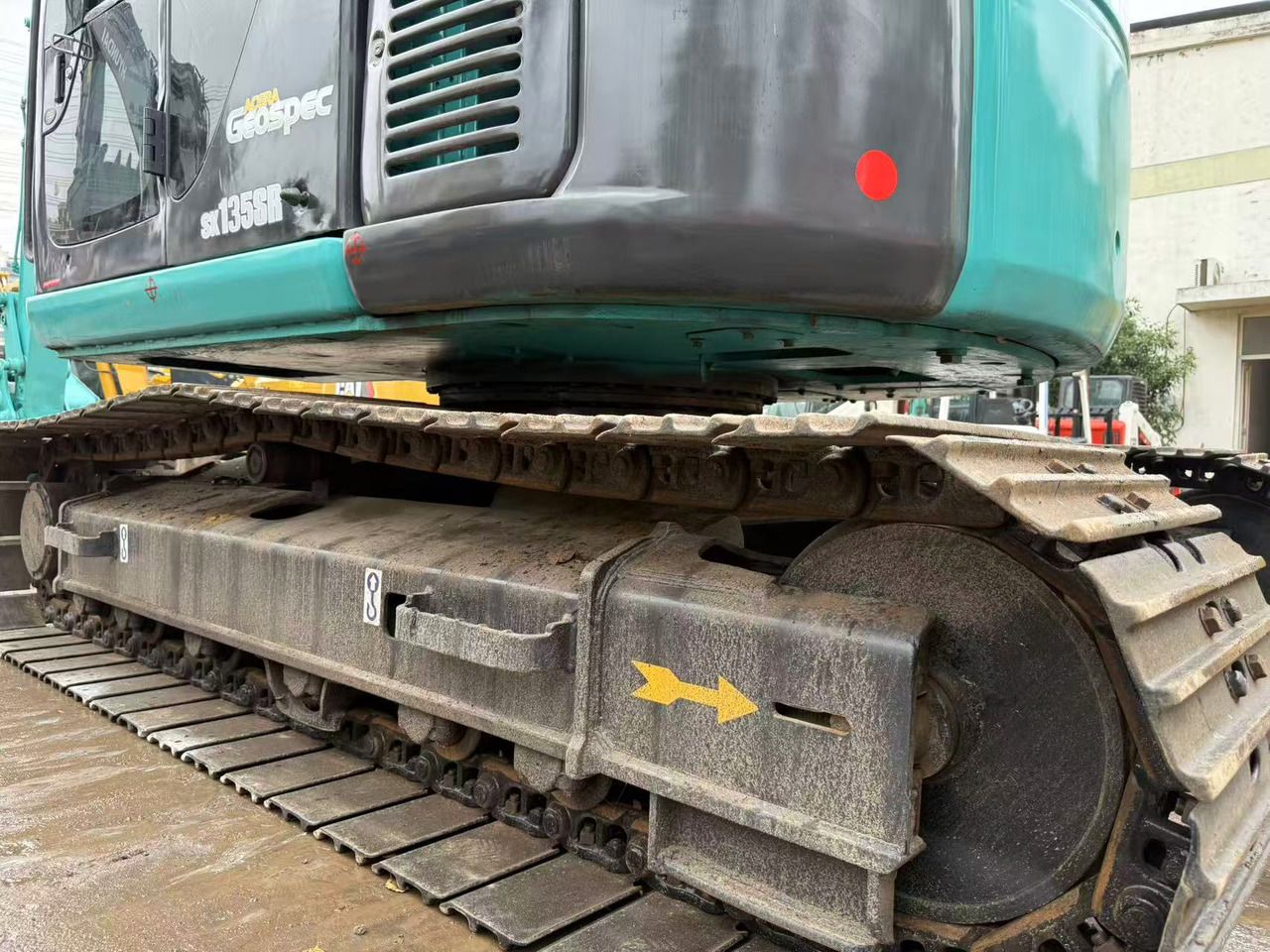 2015 Kobelco SK135SR crawler excavator side view of tracks and undercarriage 2015 Kobelco SK135SR crawler excavator side view of tracks and undercarriage