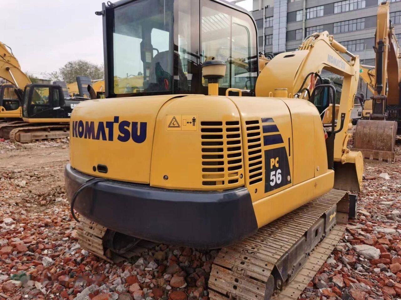 Komatsu PC56 mini excavator, rear three-quarter view