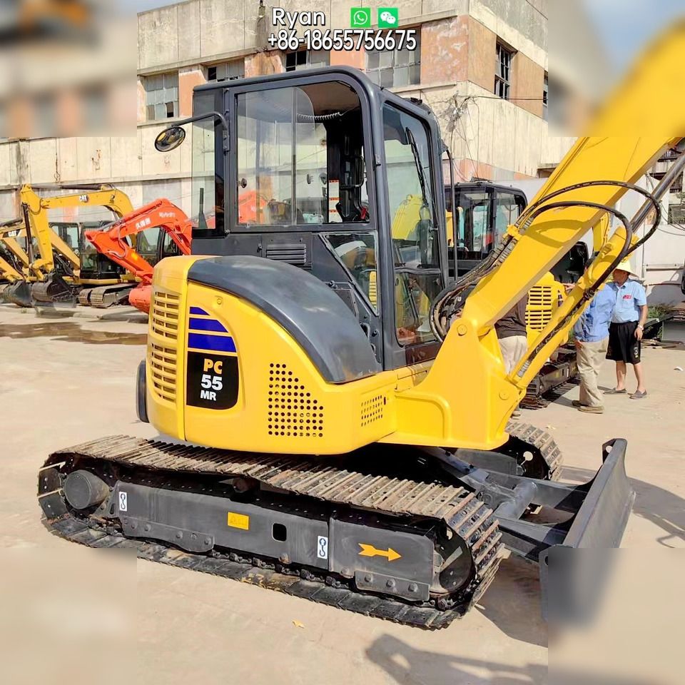 Komatsu PC55MR-2 mini excavator, side view Komatsu PC55MR-2 mini excavator, side view