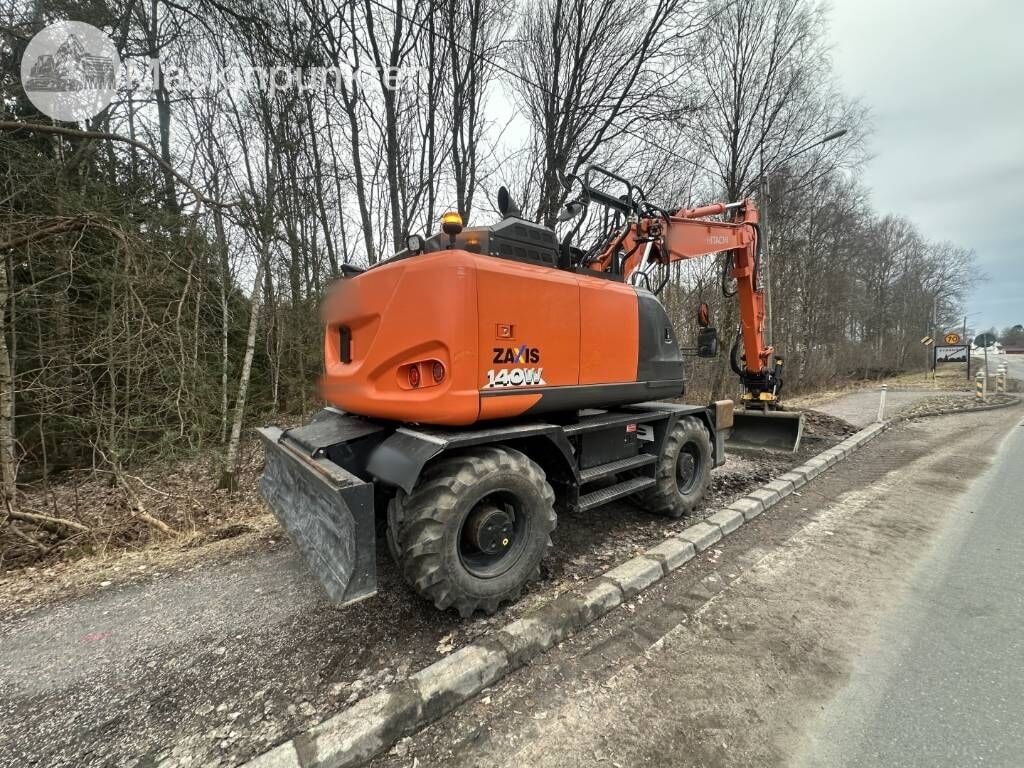 2018 Hitachi Zaxis 140W wheel excavator, rear three-quarter view 2018 Hitachi Zaxis 140W wheel excavator, rear three-quarter view