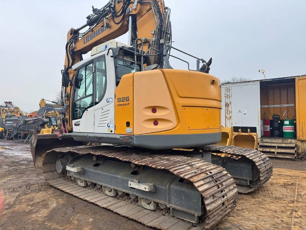 2015 Liebherr R926 Compact crawler excavator, rear three-quarter view 2015 Liebherr R926 Compact crawler excavator, rear three-quarter view