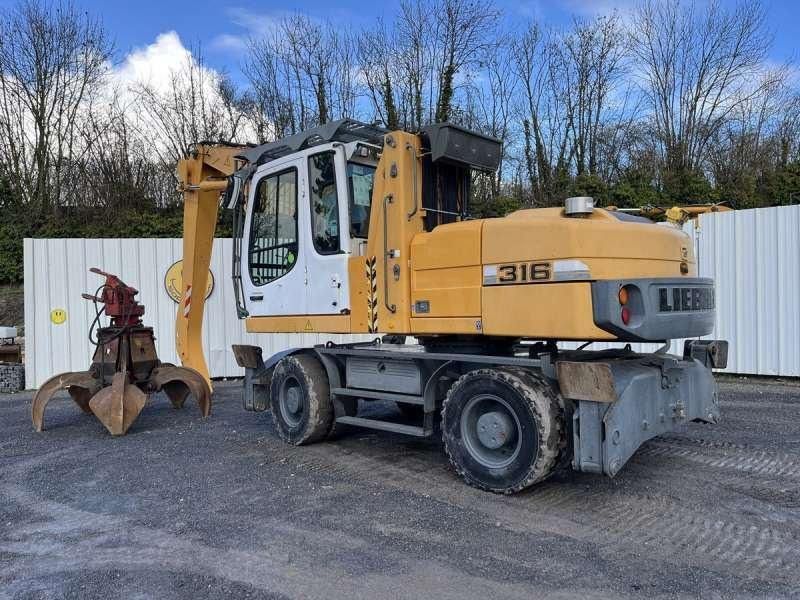 2012 Liebherr 316 material handler, side view 2012 Liebherr 316 material handler, side view