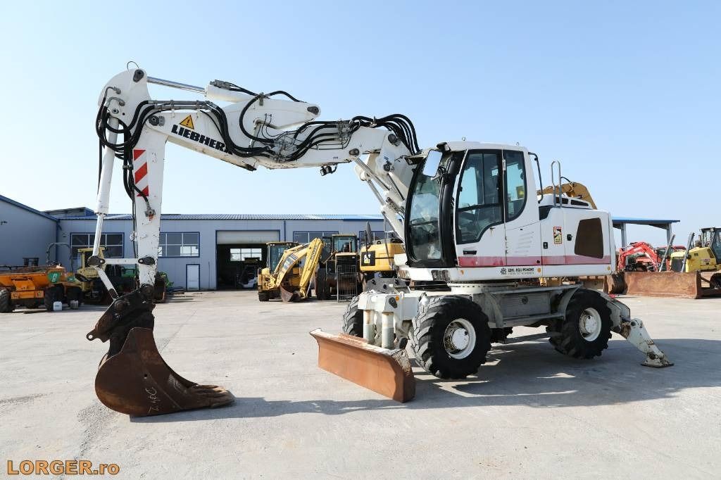 2012 Liebherr A914 wheel excavator, side profile view 2012 Liebherr A914 wheel excavator, side profile view