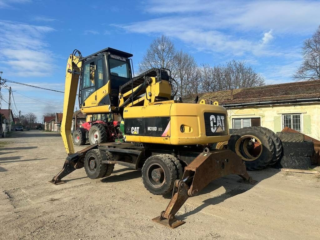 2008 Caterpillar M318D MH material handler, rear three-quarter view 2008 Caterpillar M318D MH material handler, rear three-quarter view