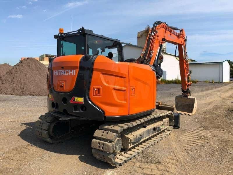 2023 Hitachi ZX95USBRP-7 crawler excavator, rear three-quarter view