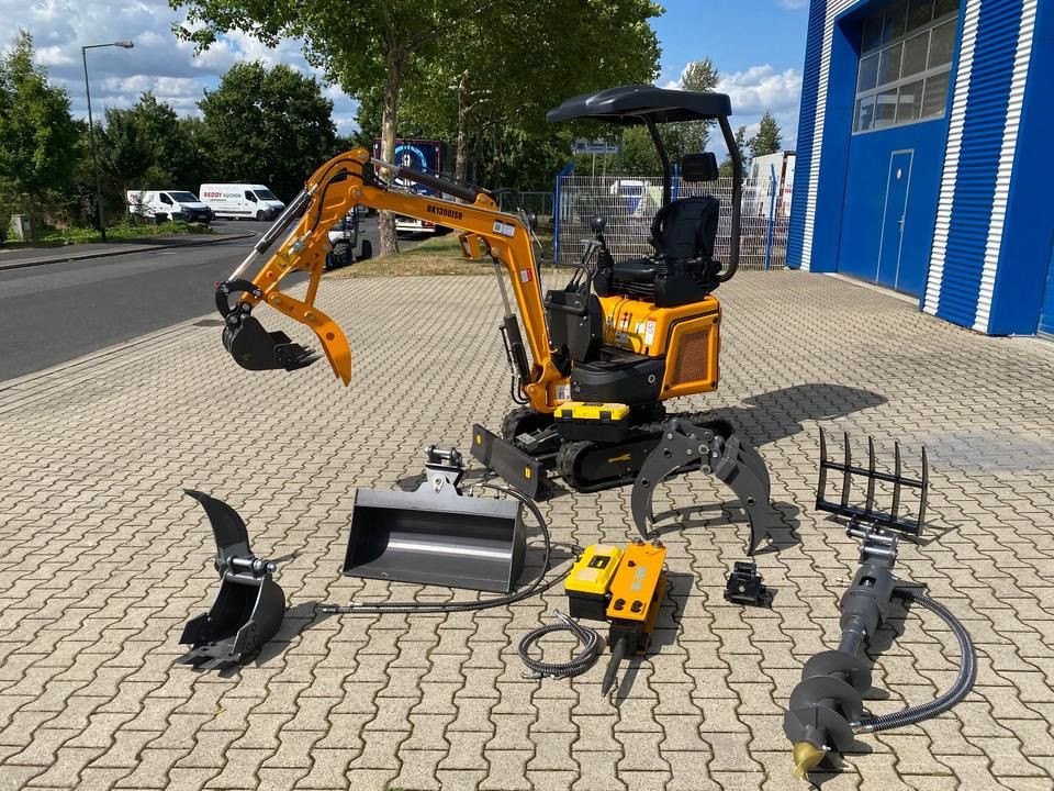 Berger Kraus BK1300JSR mini excavator with attachments, side view