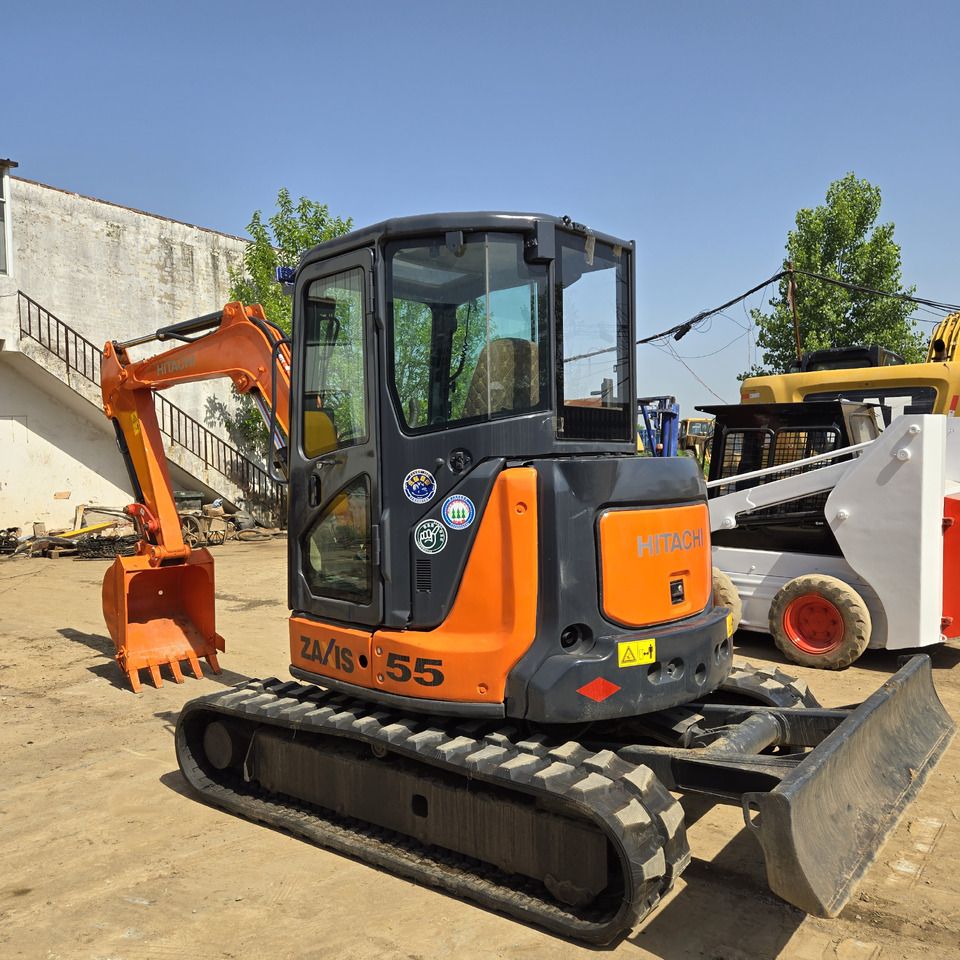 2023 Hitachi ZX55 mini excavator, rear three-quarter view 2023 Hitachi ZX55 mini excavator, rear three-quarter view